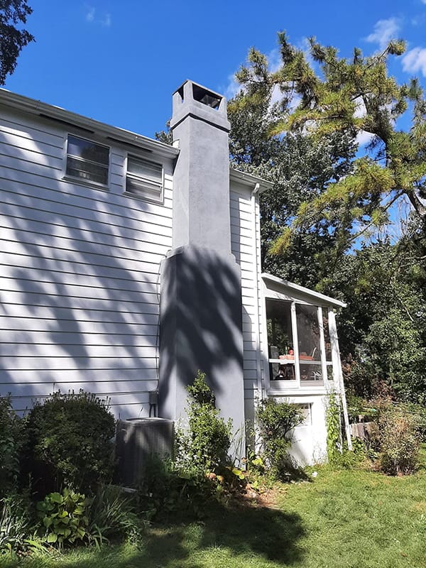 Freshly painted home exterior with updated trim and siding
