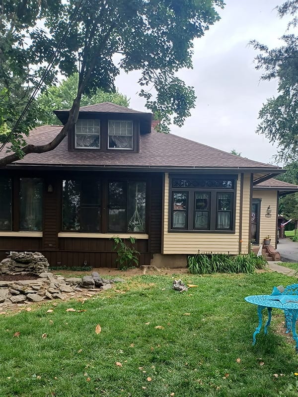 Dark brown and beige craftsman home exterior completed paint job
