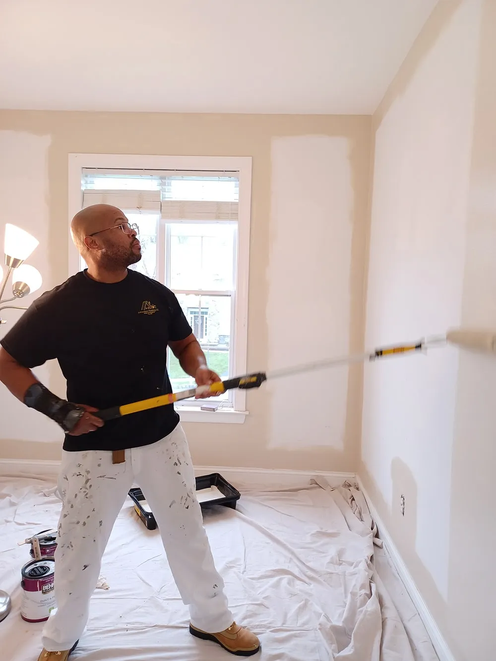 man working on custom painting project